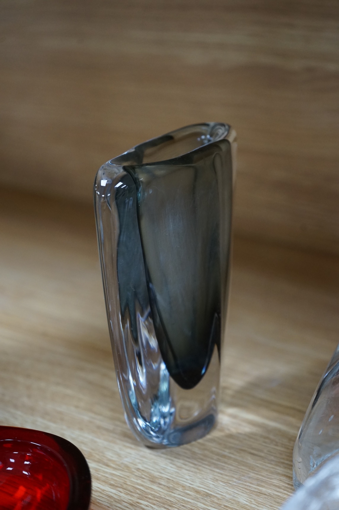 A collection of glassware including a Kosta Boda snowball pot and an Evian advertising water bottle, largest 23cm high